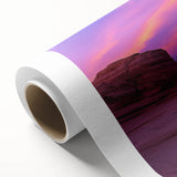 Vibrant landscape canvas print showcasing dramatic canyons in rich earthy tones, elegantly rolled and packaged in a protective cardboard tube for art lovers.
