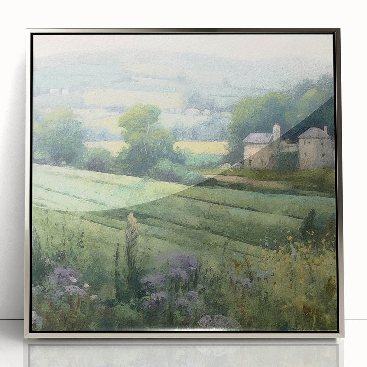 Framed acrylic wall art depicting a serene countryside landscape, showcasing vibrant greens and soft blues, with a sleek silver frame enhancing modern decor.