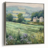 Framed landscape wall art featuring a serene countryside scene with lush green fields and a blue sky, accented by a sleek silver frame, perfect for home decor.