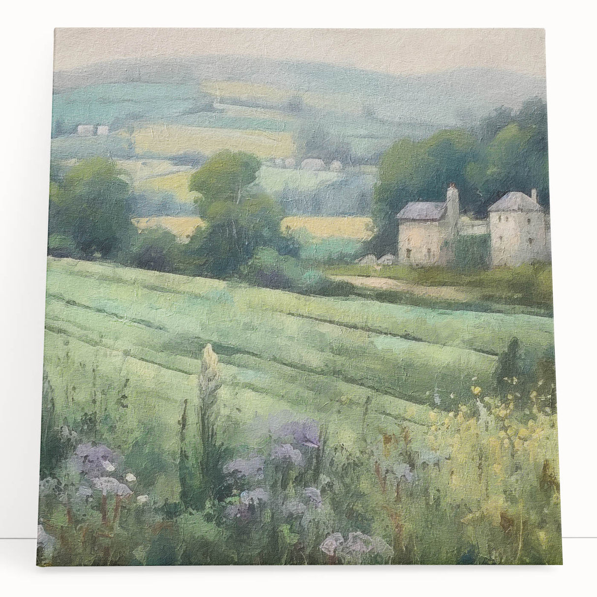 Stretched canvas wall art depicting a serene countryside landscape with rolling hills, lush greenery, and a clear blue sky, perfect for home decor or office ambiance.