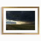 Elegant gold-framed landscape artwork featuring a serene countryside scene with vibrant green fields and a blue sky, perfect for home decor.
