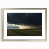 Silver-framed landscape artwork showcasing a serene countryside scene, featuring lush green fields and a clear blue sky, ideal for home decor enhancement.