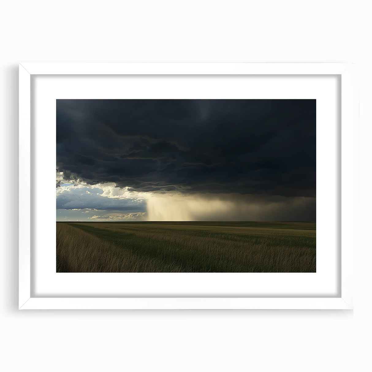 White-framed landscape artwork showcasing a serene countryside scene, featuring lush green fields and a clear blue sky, ideal for home decor enhancements.