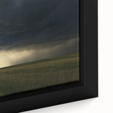 Close-up of a framed canvas showcasing a serene countryside landscape, featuring lush green fields and a clear blue sky, ideal for home decor.