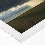 Vibrant countryside landscape rolled canvas print showcasing lush green fields under a bright blue sky, perfect for adding a serene touch to home decor.