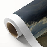 Vibrant rolled canvas showcasing a serene countryside landscape with lush green fields and a bright blue sky, elegantly packaged in a protective cardboard tube.
