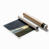 Rolled landscape print showcasing a serene countryside scene with lush green fields and a vibrant blue sky, packaged securely in a protective cardboard tube.