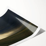 Rolled print showcasing a serene countryside landscape with lush green fields and a vibrant blue sky, elegantly packaged in a protective cardboard tube. Ideal for home decor.