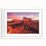 Desert landscape framed artwork with a white mat, showcasing warm tones of orange and beige, perfect for adding a serene touch to home decor.