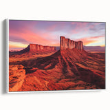 Framed canvas print depicting a serene desert landscape, showcasing warm tones of orange and beige with a white frame, ideal for modern home decor and art enthusiasts.