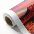 Desert landscape rolled canvas art showcasing vibrant colors and intricate details of sand dunes and a sunset, elegantly packaged in a protective cardboard tube.