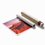 Desert landscape rolled canvas print showcasing vibrant hues of orange and gold, featuring intricate details of dunes and sky, elegantly packaged in a protective tube.