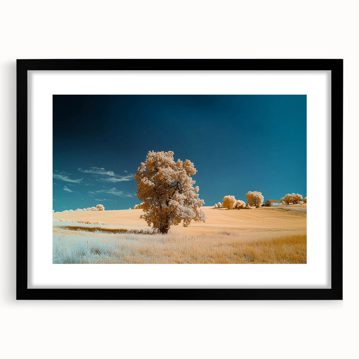 Black-framed landscape artwork featuring vibrant green fields and a serene sky, elegantly matted for a polished display, perfect for home décor.