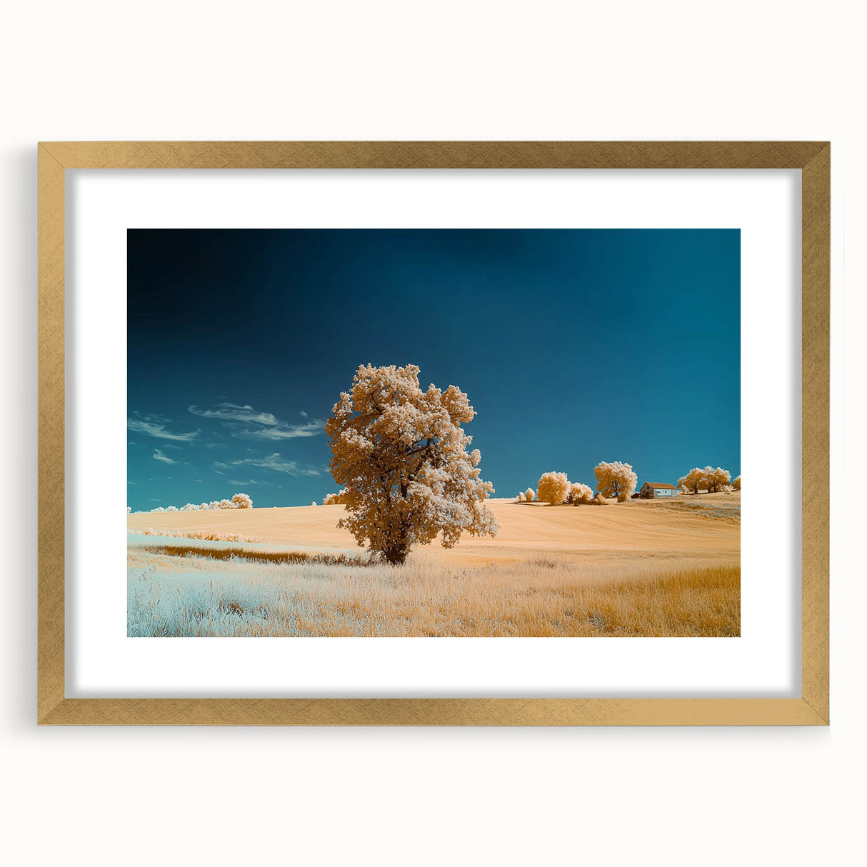 Elegant gold-framed landscape artwork featuring vibrant fields and serene skies, enhanced by a white mat for a sophisticated display. Ideal for home decor.