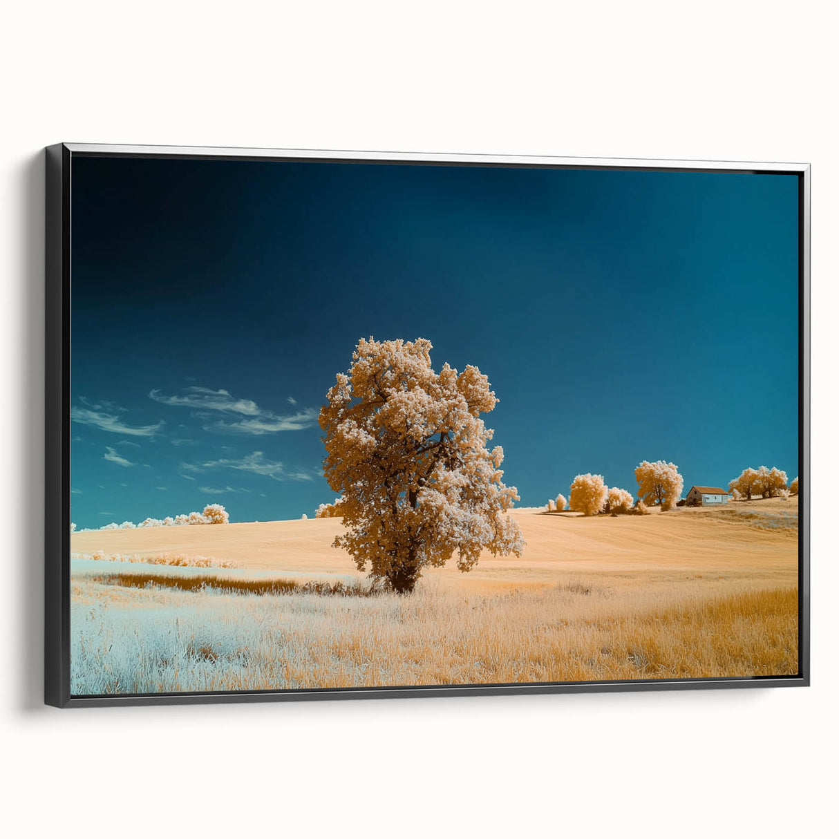 Framed landscape canvas art showcasing vibrant green fields under a bright blue sky, with a sleek black frame emphasizing the artwork's colors and depth.