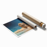 Vibrant rolled canvas print showcasing a serene landscape with lush green fields and soft blue skies, elegantly packaged in a protective cardboard tube for easy transport and display. Perfect for adding a touch of nature-inspired decor to any living space or office.