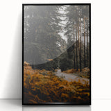 Large abstract wall art depicting autumn trees in orange and brown tones, framed in black acrylic.