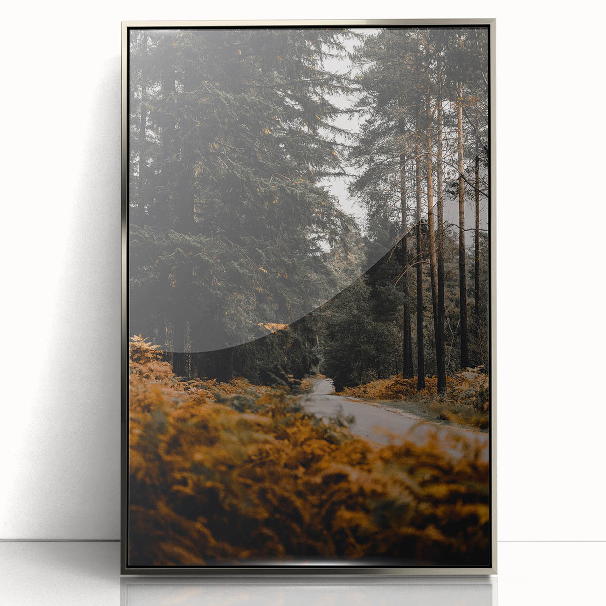 Mid-century modernist art depicting an abstract fall scene in warm orange and brown tones on a silver-framed acrylic print.