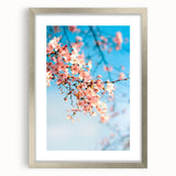 Textured abstract art print in pastel shades, framed in silver, ideal for modern bedroom ambiance.