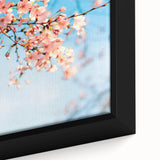 Close-up of a framed canvas featuring black textured art with colorful abstract designs, ideal for living room decor.