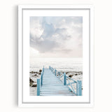 Abstract art print featuring swirling blue and white patterns on a framed canvas, suitable for dining room or bedroom decor.