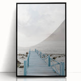 Large abstract wall art in mid-century modernist style, featuring swirling blue and green hues, framed in black acrylic.