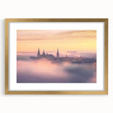 Elegant gold-framed landscape artwork depicting a serene castle scene, complete with a white mat for added sophistication, perfect for home decor.