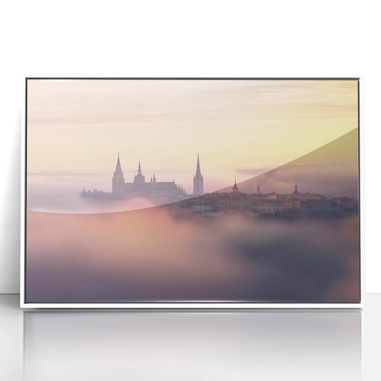 Framed acrylic artwork depicting a picturesque landscape with a majestic castle surrounded by vibrant greenery, set in a sleek white frame for modern decor.
