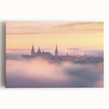 Stretched canvas artwork depicting a vibrant landscape with a majestic castle, surrounded by lush greenery and a blue sky, perfect for home decor enthusiasts.