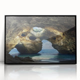Framed acrylic artwork showcasing a stunning landscape with caves, featuring a sleek black frame and a modern aesthetic, perfect for elevating home decor.