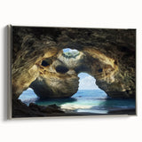 Framed canvas artwork showcasing a silver-framed landscape scene with intricate cave details, perfect for modern home decor. This piece adds a touch of sophistication and natural beauty to any room.