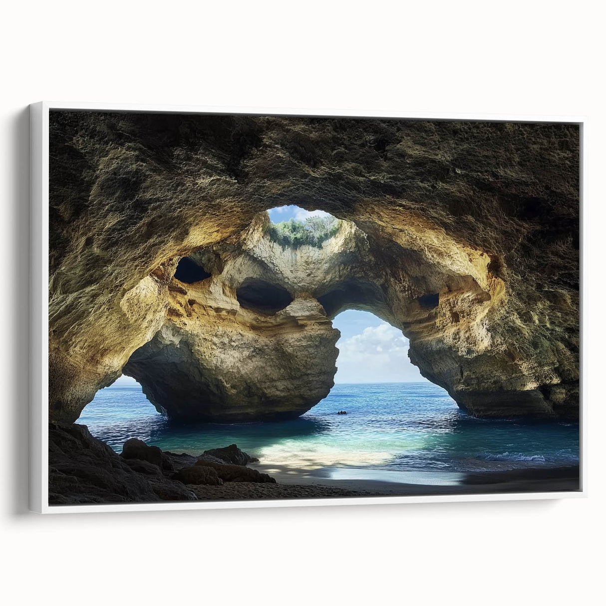 Framed canvas artwork showcasing a serene landscape with caves, presented in a white frame, ideal for enhancing modern home decor. Perfect for art lovers seeking unique wall accents.