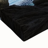 Close-up of a vibrant stretched canvas depicting an intricate landscape with caves, showcasing rich colors and textures, perfect for home decor.