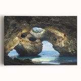 Stretched canvas artwork depicting a vibrant landscape with intricate cave formations and lush greenery, ideal for enhancing home decor and artistic ambiance.