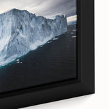 Close-up of a framed canvas depicting a stunning landscape with dramatic cliffs, showcasing vibrant colors and intricate details, ideal for home decor.