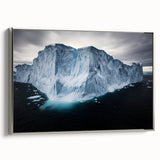Framed canvas artwork depicting a dramatic landscape with rugged cliffs, showcased in a sleek silver frame, ideal for modern home decor. Perfect for nature enthusiasts.