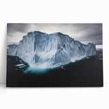 Stretched canvas artwork showcasing a dramatic cliff landscape in vibrant colors, leaning against a wall, ideal for enhancing home decor with natural beauty.