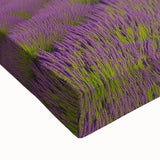 Close-up view of a stretched canvas showcasing a vibrant landscape barn design, featuring rich colors and detailed textures, ideal for home decor.