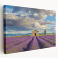 Stretched canvas artwork depicting a serene landscape scene with a rustic barn under a bright blue sky, showcasing rich colors and intricate details, ideal for home decor.