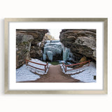 Framed landscape artwork showcasing canyons in vibrant colors, featuring a silver mat and frame. Ideal for home decor, adding a touch of nature-inspired elegance to any space.