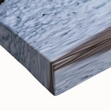 Close-up of a stretched canvas artwork depicting vibrant, textured canyons in earthy tones, perfect for adding a natural touch to home decor or office spaces.