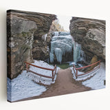 Stretched canvas artwork depicting a vibrant landscape of canyons in rich earthy tones, showcasing dramatic rock formations and a serene sky, perfect for home decor.