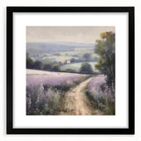 Framed landscape wall art depicting a serene countryside scene with lush green fields and a cloudy sky, featuring a sleek black frame and white matting for an elegant presentation, perfect for home decor.