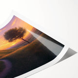 Rolled canvas print showcasing a serene countryside landscape with vibrant green fields and a clear blue sky. Ideal for home decor, it comes securely packaged in a protective tube for easy transport and storage.