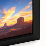 Close-up of a framed desert landscape canvas featuring warm earth tones and intricate details, showcasing a serene sunset over sand dunes, perfect for home decor.
