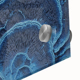 Large abstract floral print in vibrant orange and red tones on acrylic glass.