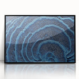 Large abstract wall art featuring close-up floral designs in vibrant colors on a black acrylic framed print.
