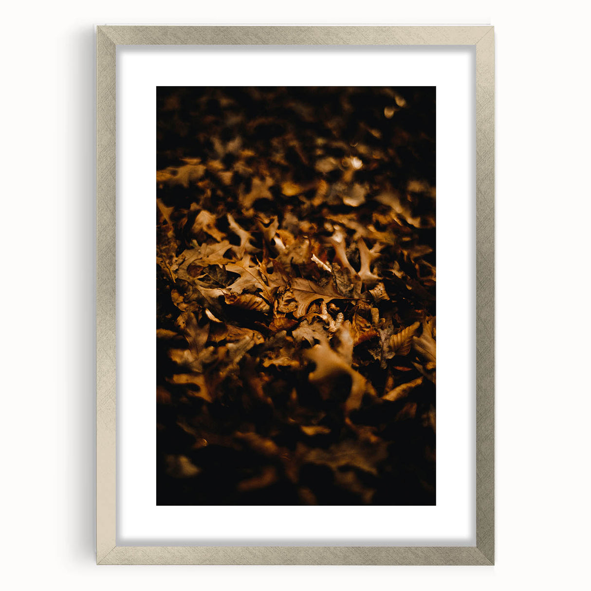 Textured abstract art print depicting autumn colors in silver frame, suitable for bedroom wall decor.