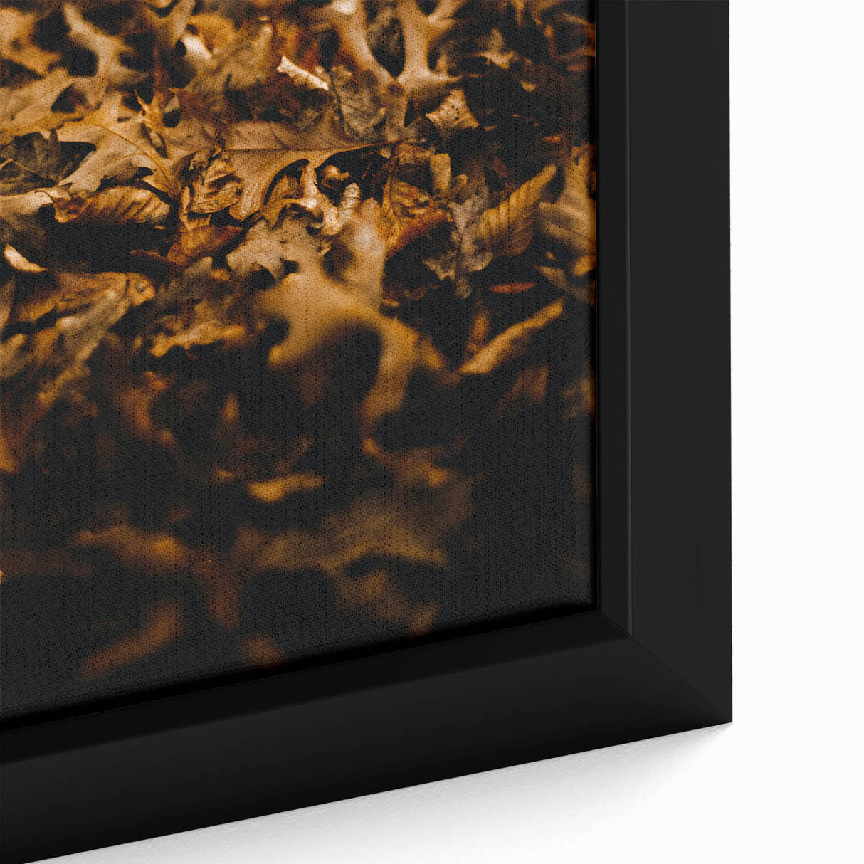 Close-up of a framed canvas featuring a black textured abstract design with colorful accents, ideal for living room decor.