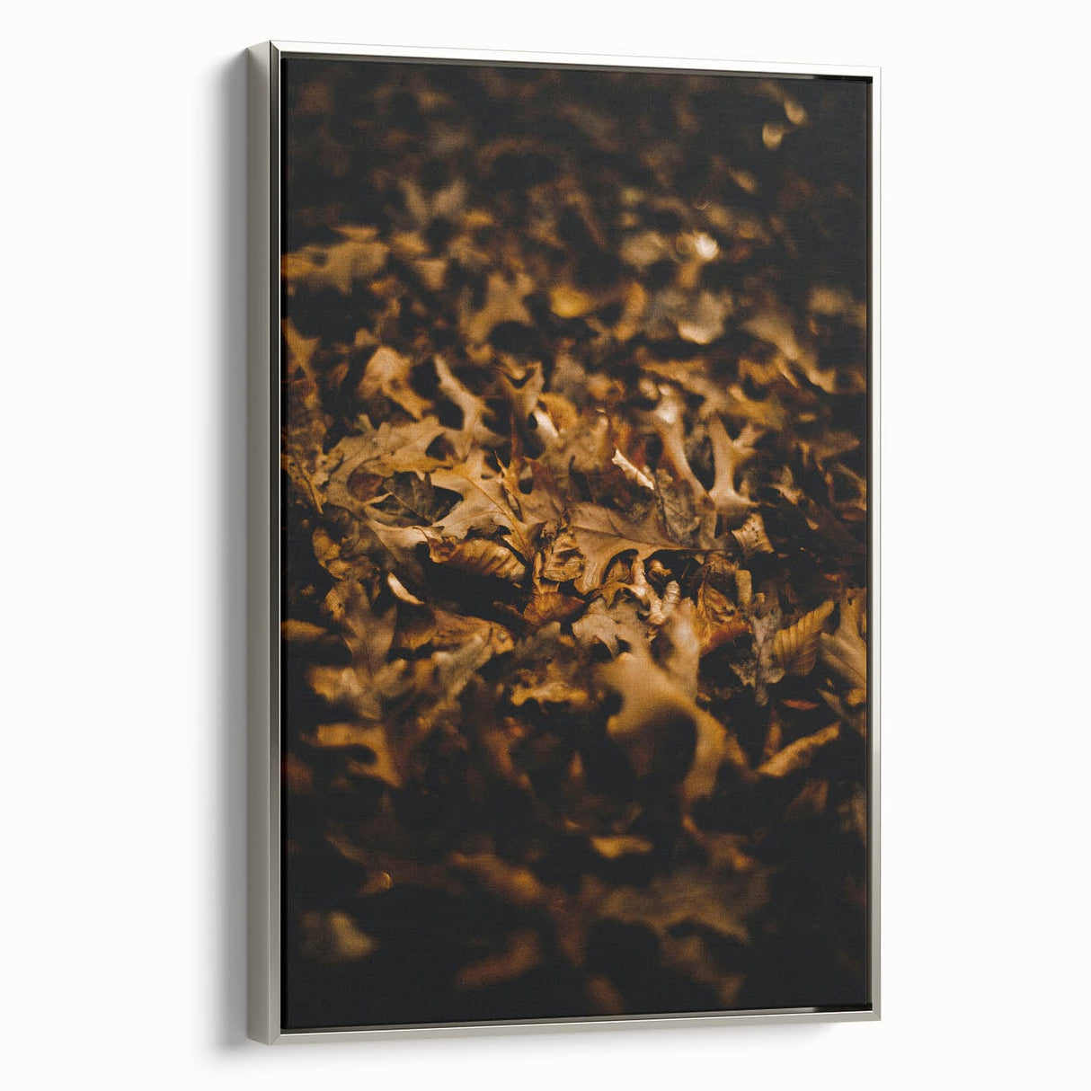 Side view of a framed canvas depicting a fall landscape with colorful leaves, ideal for living room decor.
